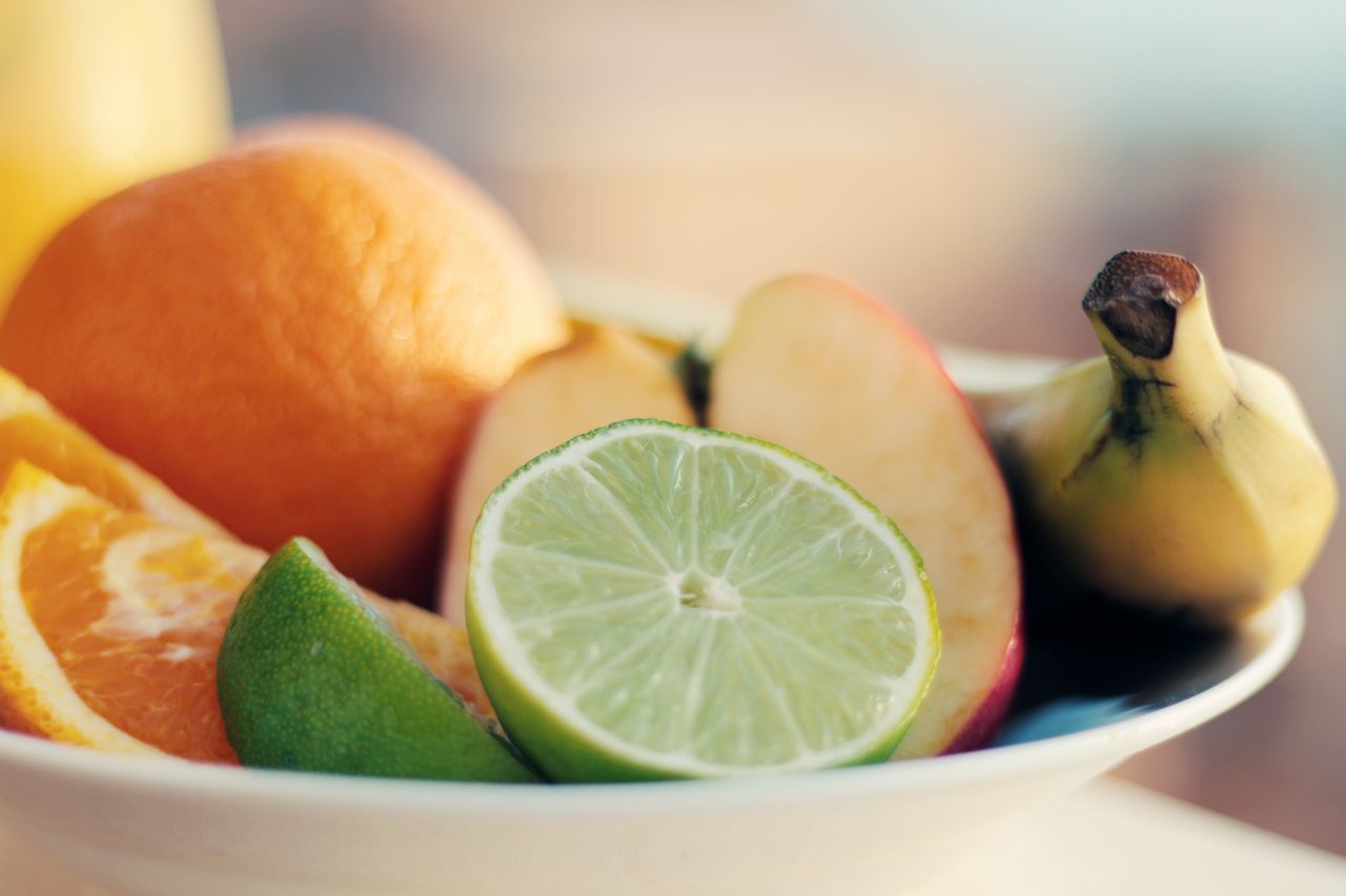 services-img A close-up of a fresh mixed fruit bowl featuring citrus, banana, and apple slices for a healthy snack.